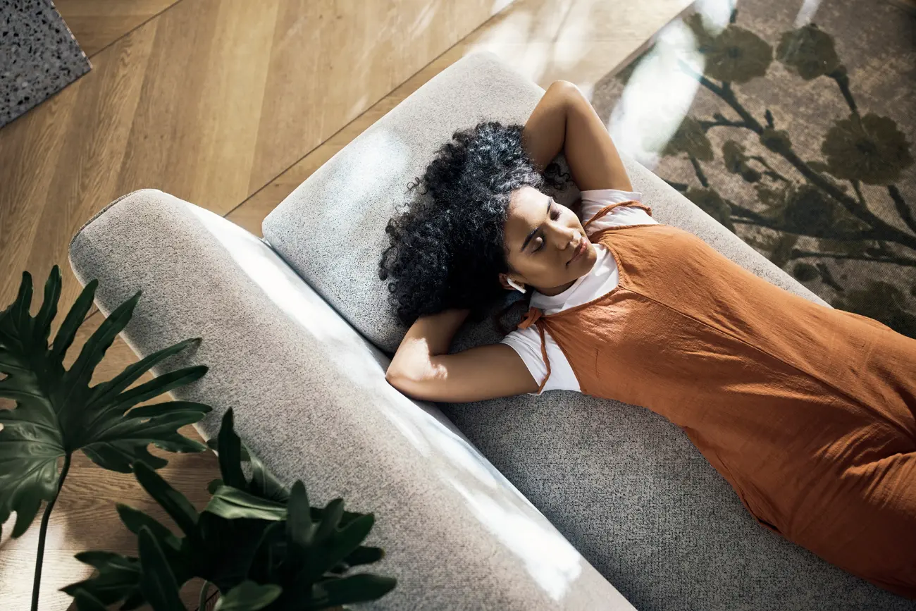 Young woman relaxing on a sofa